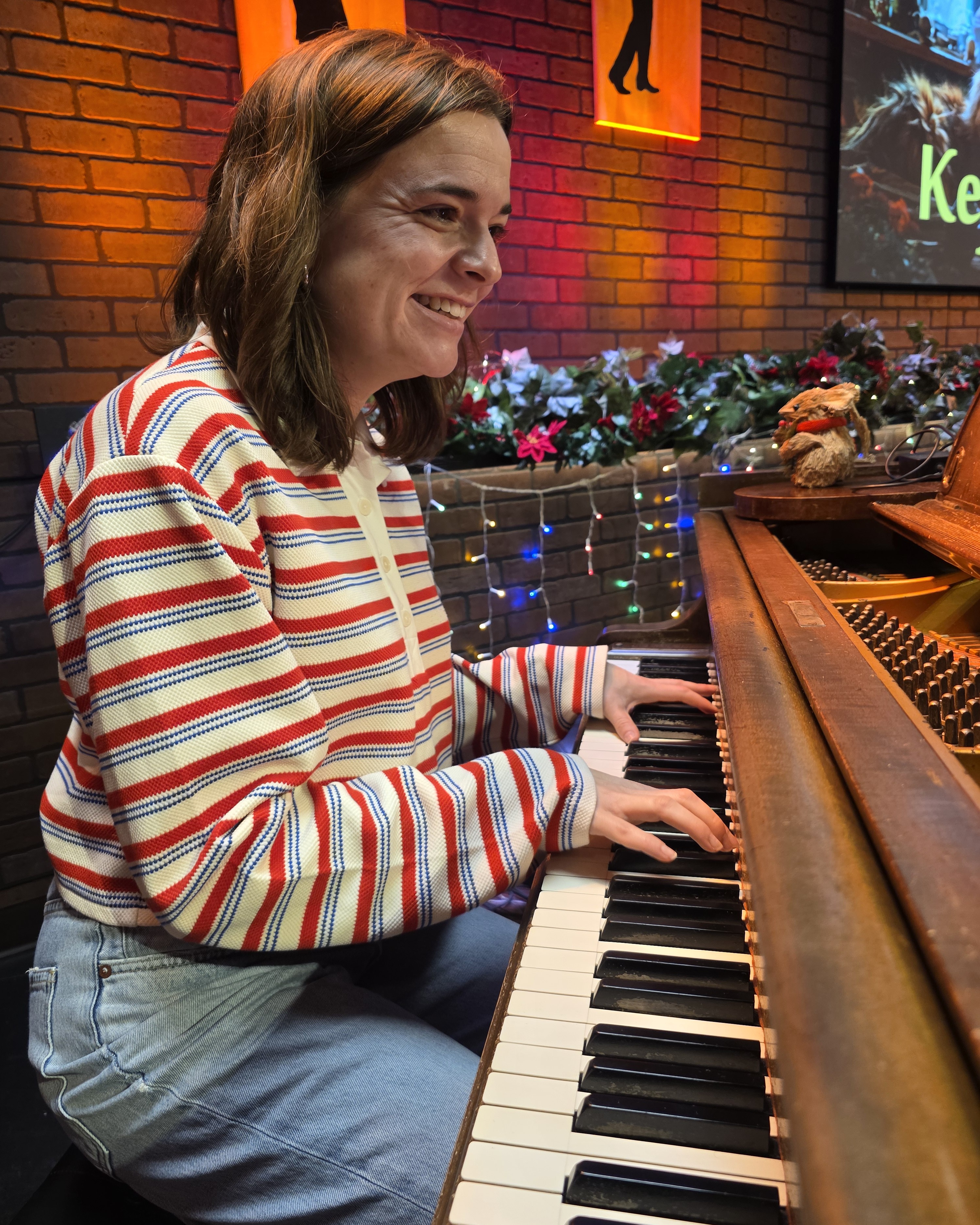 Adult student enjoying a piano lesson at Keys of Joy! Studio in Lawrence, KS