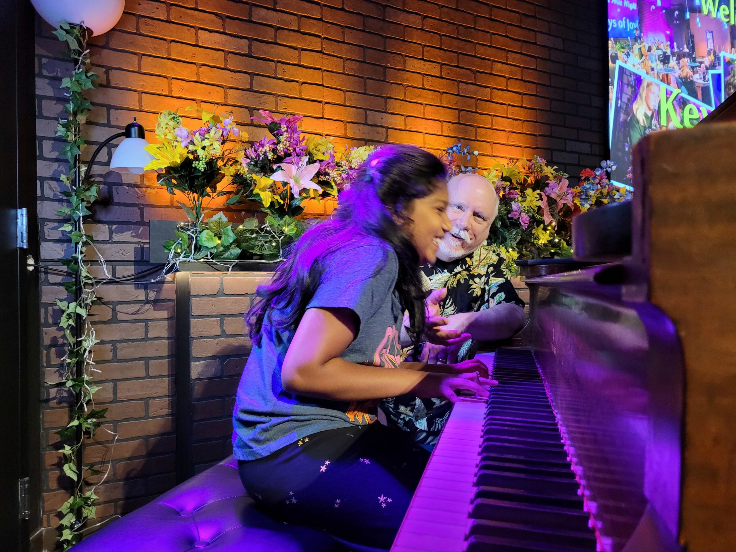 Student enjoying a piano lesson at Keys of Joy! Studio in Lawrence, KS